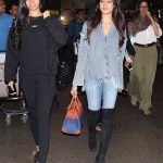 Actress daughter in denim jeans and long boot