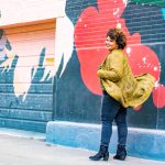 Women in Denim jeans near wall